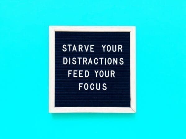 Starve your distractions feed your focus quote on felt board