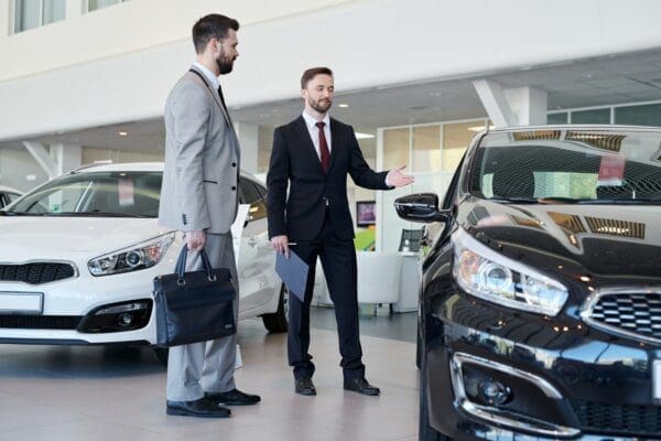 Negotiating a car sale with salesman and client