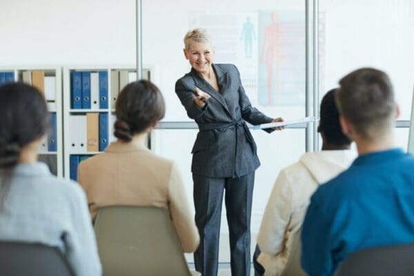 Cheerful Female Business Coach in Seminar