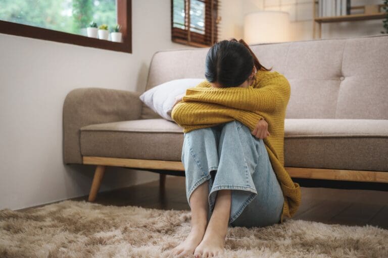 Young Asian woman alone from cabin fever working from home