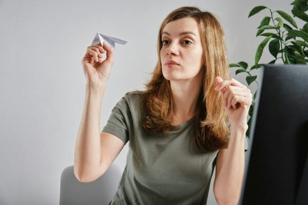 Woman procrastinating at home office workplace