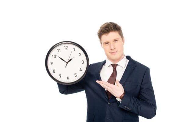 businessman holding a clock