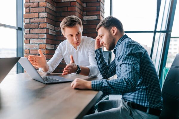 Business coaching session between two men